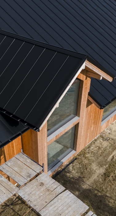 high-angle-beautiful-wooden-house-with-new-roof